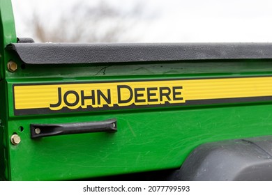 BRANT, CANADA - November 18, 2021: The John Deere Text Logo On The Bed Of A Green John Deere Gator™ Utility Vehicle.