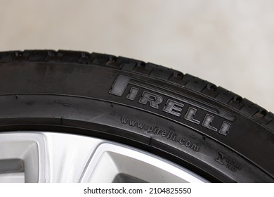 BRANT, CANADA - November 30, 2021: The Pirelli logo is on the tire of a new tire in a garage. Pirelli, an Italian tire manufacturer, is one of the largest in the world.