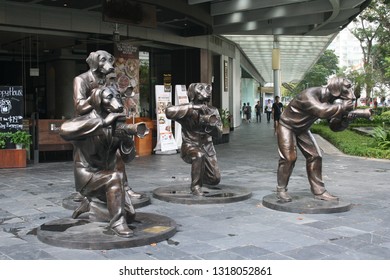 Bras Basah Road - Singapore - April 26, 2018. Paparazzi Dogs Sculptures. 