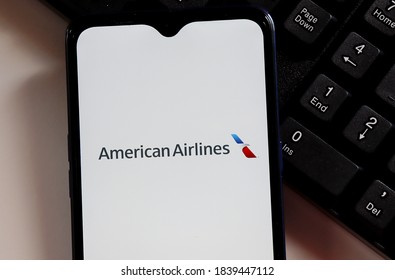 Brasil - October 22, 2020. American Airlines logo on smartphone screen on top of computer keyboard. 