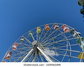 Brasilia, Brazil, July 6, 2019: The Huge Ferris Wheel At Funn Festival 2019, A Symbol Of Fun, At The Largest Winter Festival In The Brazilian Midwest. In The Background The Long Blue Sky.