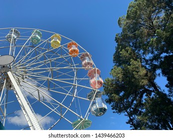 Brasilia, Brazil, July 6, 2019: The Huge Ferris Wheel At Funn Festival 2019, A Symbol Of Fun, At The Largest Winter Festival In The Brazilian Midwest. In The Background The Long Blue Sky.