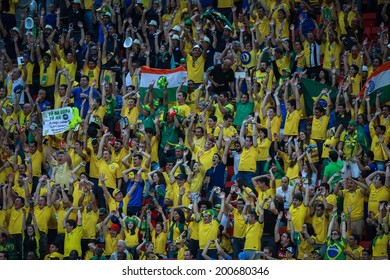 BRASILIA, BRAZIL - June 23, 2014: Brazil fans celebrating at the 2014 World Cup Group A game between Brazil and Cameroon at Estadio Nacional Mane Garrincha. No Use in Brazil.
