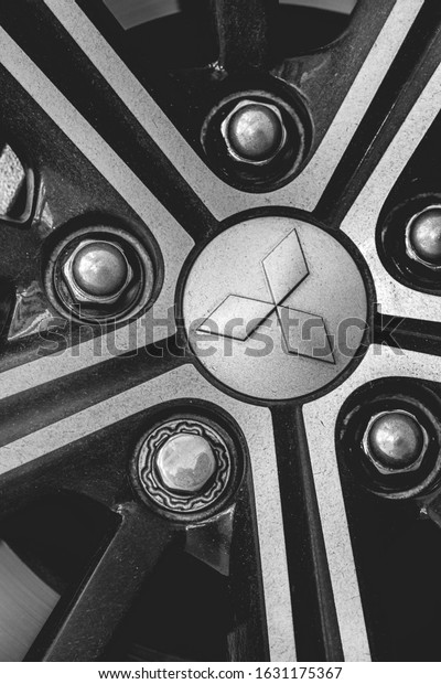 Brasilia, Federal District - Brazil.\
January, 30, 2020. Photo of a Mitsubishi Eclipse Cross model car\
wheel 2019. Japanese company emblem in macro\
style.\

