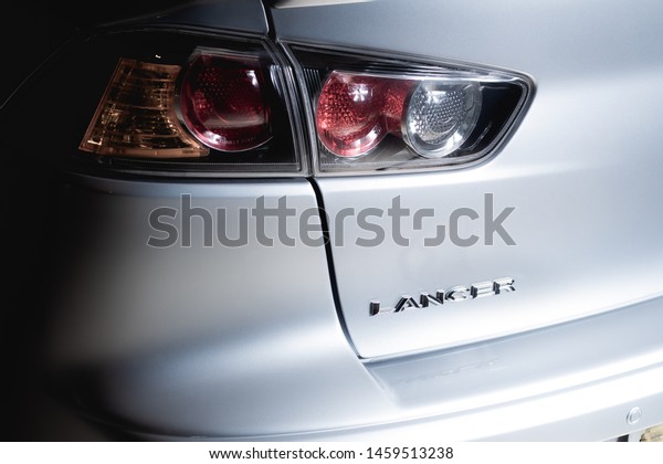 \
Brasilia, Federal District - Brazil. July 23,\
2019. Rear photo of Mitsubishi Lancer GT model silver color 2015.\
Focus on the\
letters.