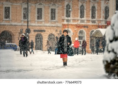 Brasov, Romania - 16 January 2016: People Walking Through The Snow Storm In Brasov, City Life In Snow Storm