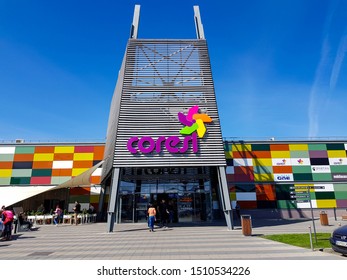 Brasov, Romania- 21 September 2019: Colorful Entrance At The Coresi Mall, Blue Sky Background.