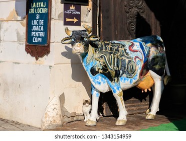 BRASOV, ROMANIA- 27 JANUARY, 2019: The Sculpture Of A Painted Cow With Colors With The Text Pizza Vitolo