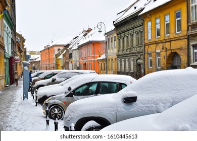 Brasov/ Romania - 9 January,2020: A View Of Some Cars In A Parking Spot Sin Brasov Covered By Snow.Brasov Is A City In Romania And The Administrative Centre Of Brașov County. 