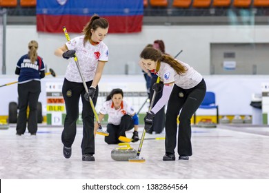 Brasov, Romania,  April 12-17, 2019.  Women playing curling in team on a skating rink during the European Curling Championships C-Division ECCC2019.