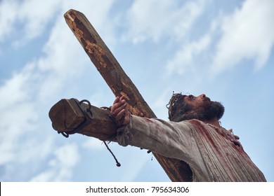 Brasov, Romania - April 14, 2017: Actor plays Jesus Christ crucified during the street reenactment of the Stations of the Cross on Good Friday.