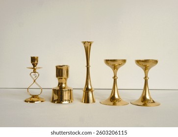 Brass candle holders in mid century modern design pattern. Denmark 1970s.