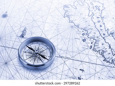 Brass Compass Rose On A Particular Of An Historical Map