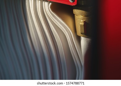 Brass fire hose reel in the cabinet