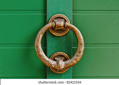 Brass Knocker On The Green Door