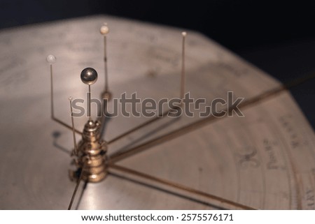 Brass mechanical orrery model showcasing the planetary alignment and orbital paths