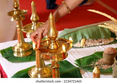 brass oil lamps setup for a traditional kerala hindu wedding ceremony.
