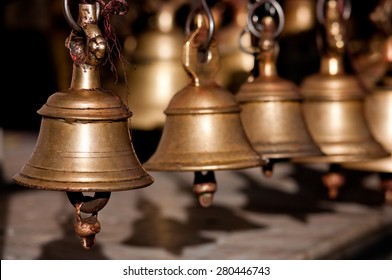 Brass praying bells hanging on old temple in Nepal
 - Shutterstock ID 280446743