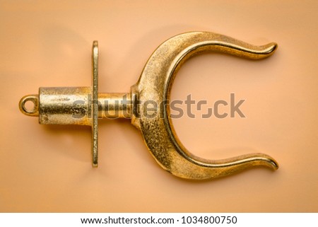 brass rowlocks (oarlock) on beige background