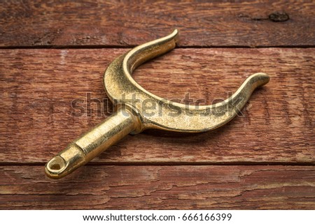 brass rowlocks (oarlock) on rustic weathered barn wood background