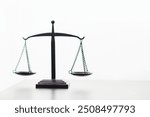 a brass scale is placed on a table in a lawyer office as a decoration and symbol of justice in the judicial process. The brass scales symbolize justice in court proceedings.Copy Space for text