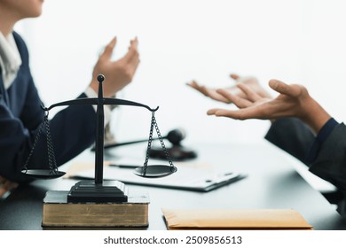 a brass scale is placed on a table in a lawyer office as a decoration and symbol of justice in the judicial process. The brass scales symbolize justice in court proceedings.Copy Space for text