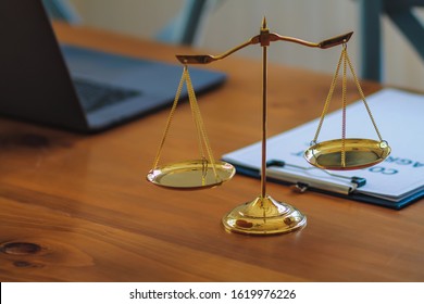 Brass scales are placed on the tables within the lawyer's office for use as decorations and as a symbol of justice in judicial proceedings.
Brass scales are a symbol of justice in court hearings.