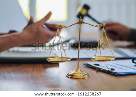Brass scales are placed on the tables within the lawyer's office for use as decorations and as a symbol of justice in judicial proceedings.
Brass scales are a symbol of justice in court hearings.