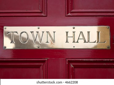 Brass Town Hall Sign On A Door.