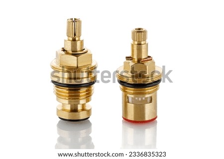 Brass tradition and new ceramic Faucet Cartridge. Swivel bronze bush for household plumbing isolated on white. Close up