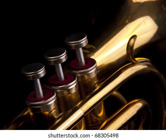 Brass Trumpet Horn On A Black Background. Soft Light Photograph.