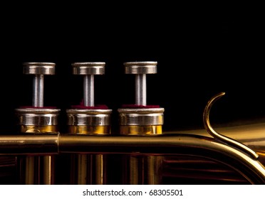 Brass Trumpet Horn On A Black Background. Soft Light Photograph.