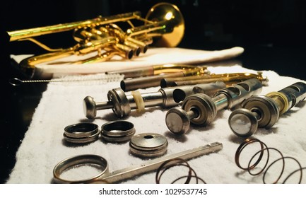 Brass Trumpet Pieces Lay Out During Instrument Cleaning And Repair