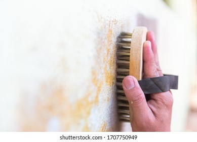 Brass Wire Brush Cleaning Surface Of Wall