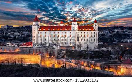 Bratislava castle on the hill over Danube river after sunset in the Bratislava old town, Slovakia
