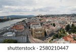 Bratislava city with historic buildings and streets, sunlit with cloud shadow over river