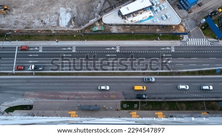 Bratislava city street with cars on the divided lanes, top down aerial view with construction sites in Slovakia