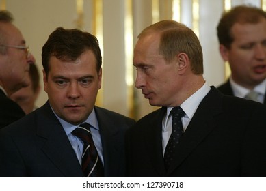 BRATISLAVA - FEBRUARY 25:  Russian President Vladimir Putin, Right, Speaks With Kremlin Chief Of Staff Dmitry Medvedev In Bratislava, Slovakia, On February 25, 2005.