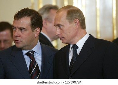 BRATISLAVA - FEBRUARY 25:  Russian President Vladimir Putin, Right, Speaks With Kremlin Chief Of Staff Dmitry Medvedev In Bratislava, Slovakia, On February 25, 2005.