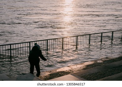 Bratislava, Slovakia, 2018. High Water Level Of Danube River In Bratislava, Child Playing On The Side. Climate Change. Weather. 