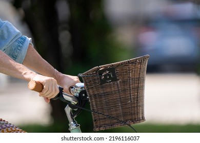 Bratislava, Slovakia - 24 August 2022: Selective Focus Of Handlebar And Wicker Basket Of Woman Bicycle.