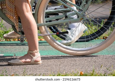 Bratislava, Slovakia - 24 August 2022: Sexy Woman In Summer Dress On Vintage Looking Bicycle.