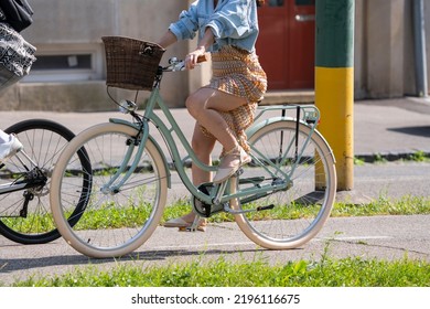 Bratislava, Slovakia - 24 August 2022: Sexy Woman In Summer Dress On Vintage Looking Bicycle.