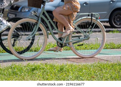 Bratislava, Slovakia - 24 August 2022: Sexy Woman In Summer Dress On Vintage Looking Bicycle.