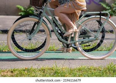 Bratislava, Slovakia - 24 August 2022: Sexy Woman In Summer Dress On Vintage Looking Bicycle.