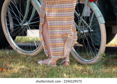 Bratislava, Slovakia - 24 August 2022: Woman Near The White Vintage Bicycle In The Park.