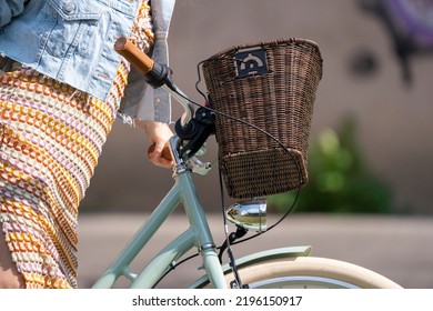 Bratislava, Slovakia - 24 August 2022: Selective Focus Of Handlebar And Wicker Basket Of Woman Bicycle.