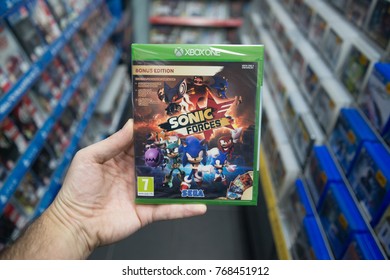 Bratislava, Slovakia, December 1, 2017: Man Holding Sonic Forces Videogame On Microsoft XBOX One Console In Store