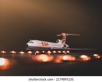 BRATISLAVA, SLOVAKIA - DECEMBER 10 2019: Airplane Tupolev TU-154M CSA On Runway. Scale Model Airport. Czechoslovak Airlanes. Runway Lights In Background.