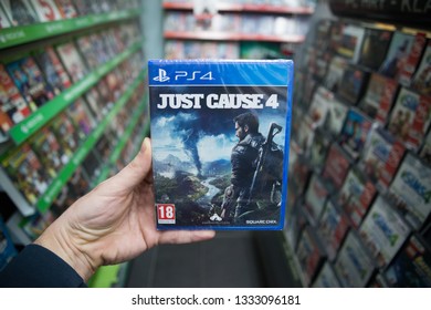 Bratislava, Slovakia, March 8 2019: Man Holding Just Cause 4 Videogame On Sony Playstation 4 Console In Store